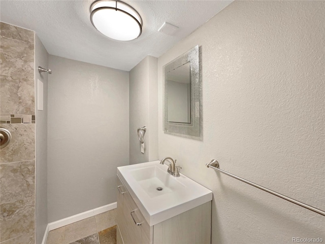 bathroom featuring vanity and a textured ceiling