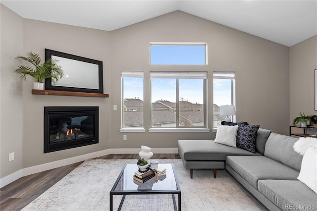 living room featuring hardwood / wood-style floors and high vaulted ceiling