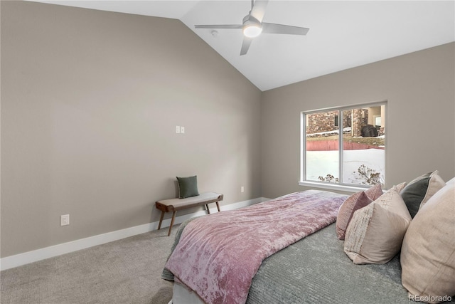 carpeted bedroom featuring ceiling fan and vaulted ceiling