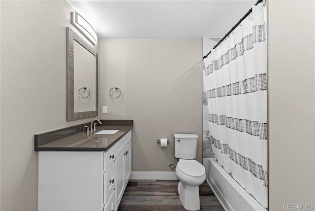 full bathroom featuring toilet, vanity, shower / bathtub combination with curtain, and hardwood / wood-style floors