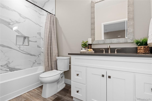 full bathroom featuring shower / bath combo, wood-type flooring, vanity, and toilet