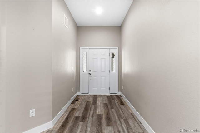 doorway with dark wood-type flooring