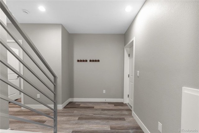 stairway featuring wood-type flooring