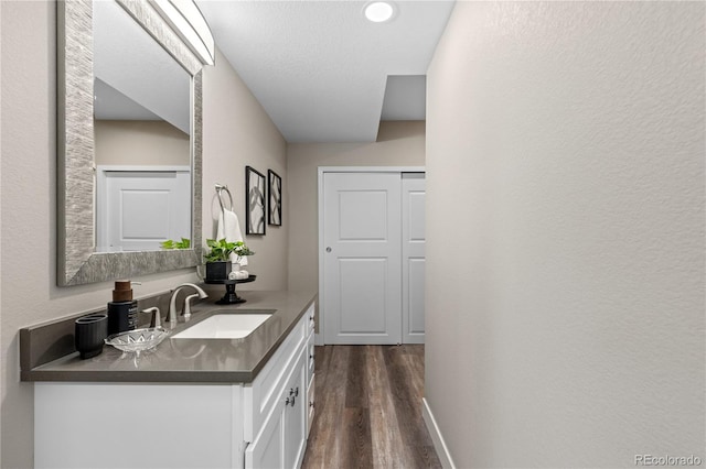 bathroom featuring vanity and wood-type flooring