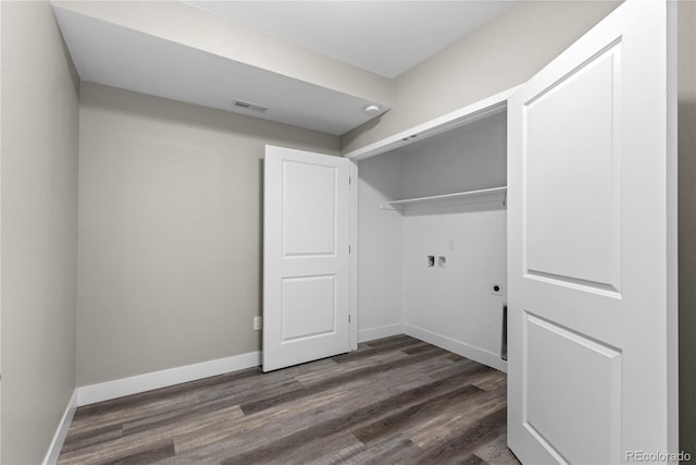 laundry room with electric dryer hookup, hookup for a washing machine, and dark hardwood / wood-style floors