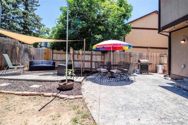 3688 S Cathay Cir, Aurora, CO 80013 - fenced backyard featuring a patio, grilling area, and outdoor dining space