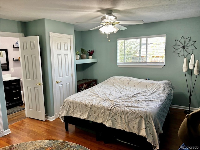4303 S Yank St, Morrison, CO 80465 - bedroom with wood finished floors, ceiling fan, and baseboards