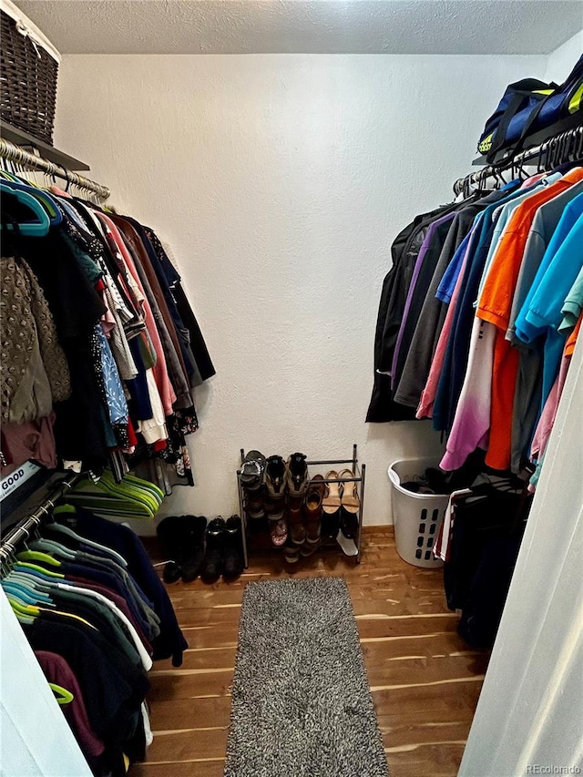 4303 S Yank St, Morrison, CO 80465 - walk in closet featuring wood finished floors