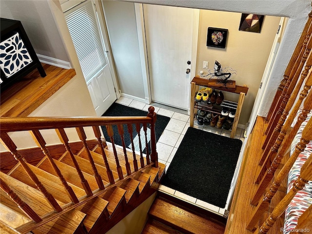 4303 S Yank St, Morrison, CO 80465 - foyer featuring stairway, tile patterned floors, and baseboards
