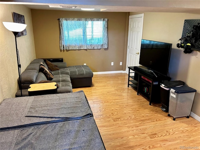 4303 S Yank St, Morrison, CO 80465 - living room featuring light wood-style flooring and baseboards