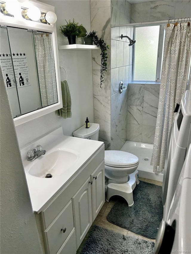 4303 S Yank St, Morrison, CO 80465 - full bathroom with a stall shower, vanity, toilet, and tile patterned flooring