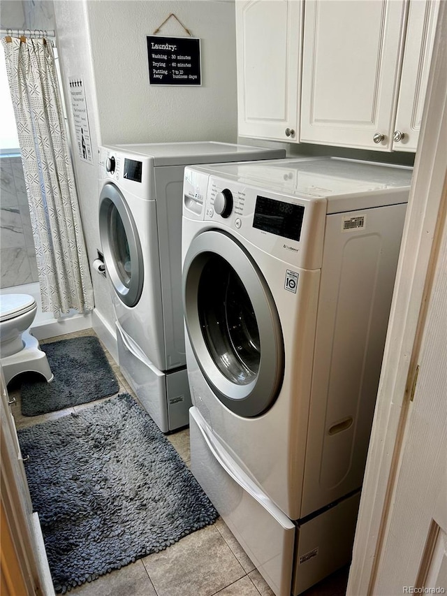 4303 S Yank St, Morrison, CO 80465 - washroom with independent washer and dryer and light tile patterned flooring