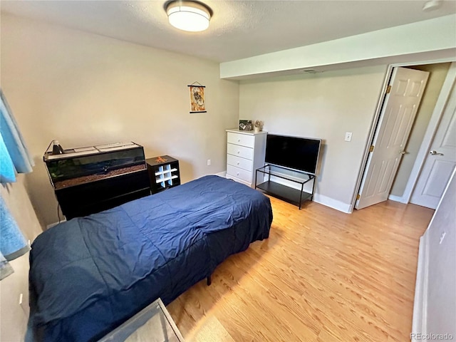 4303 S Yank St, Morrison, CO 80465 - bedroom with wood finished floors and baseboards