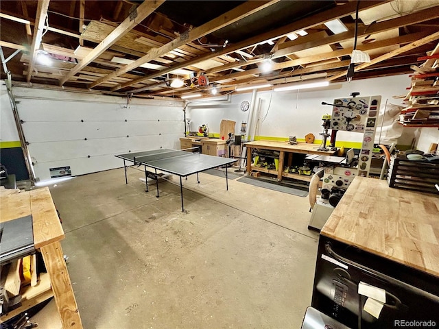 4303 S Yank St, Morrison, CO 80465 - garage featuring a workshop area