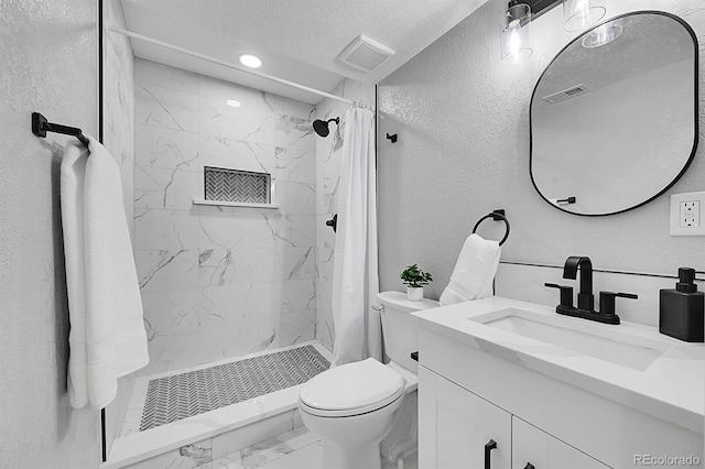 bathroom featuring walk in shower, vanity, toilet, and a textured ceiling