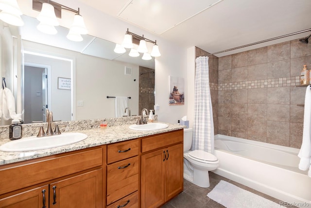 full bathroom featuring toilet, shower / bath combo with shower curtain, vanity, and tile patterned floors