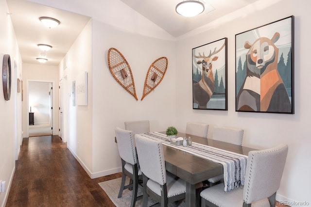 dining room with dark hardwood / wood-style flooring