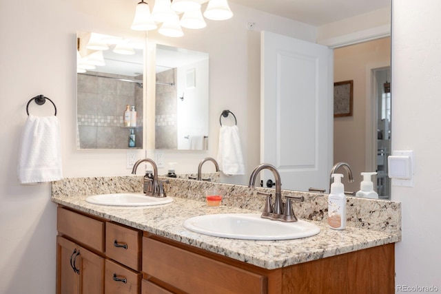 bathroom with vanity and a shower with shower door