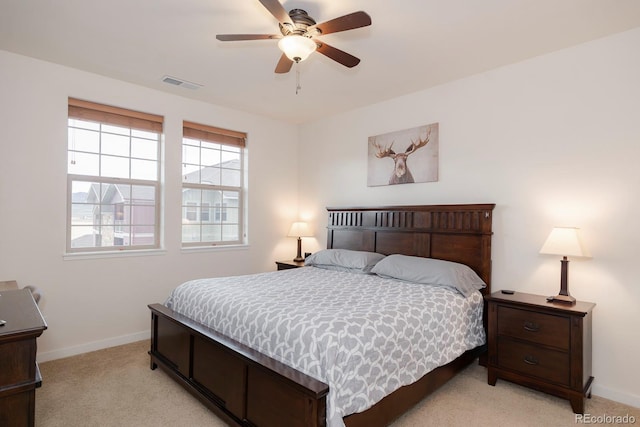 bedroom with light carpet and ceiling fan