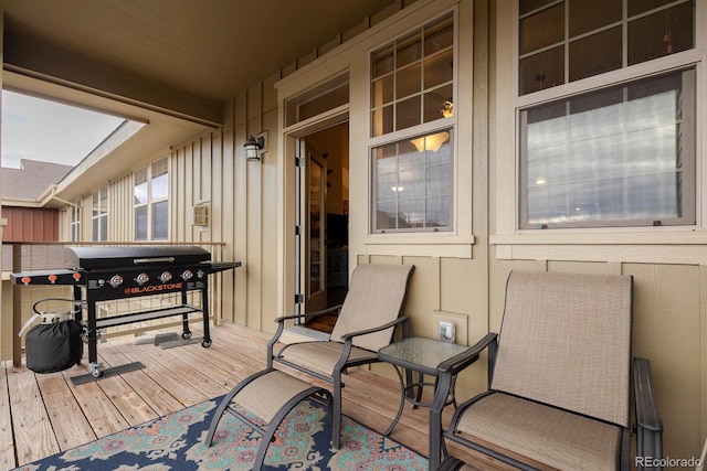 wooden deck featuring area for grilling