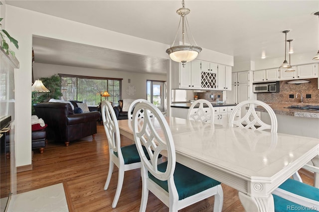 6492 S Piney Creek Cir, Centennial, CO 80016 - dining space featuring light wood-style flooring