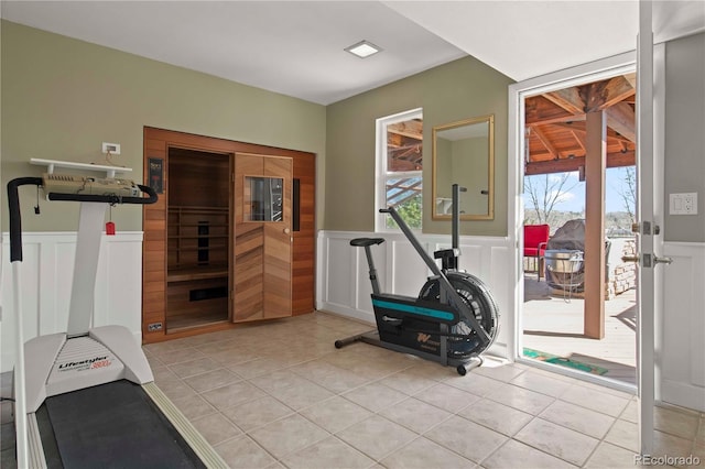 6492 S Piney Creek Cir, Centennial, CO 80016 - exercise area with wainscoting, a decorative wall, and light tile patterned flooring