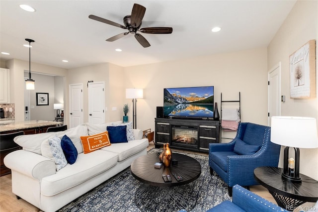 8186 E 53rd Dr, Denver, CO 80238 - living area featuring ceiling fan, recessed lighting, and a glass covered fireplace