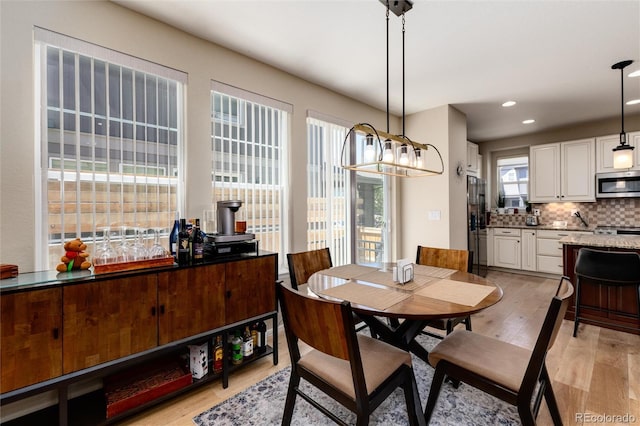 8186 E 53rd Dr, Denver, CO 80238 - dining room with light wood-style floors and recessed lighting