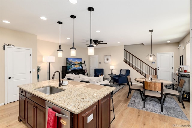 8186 E 53rd Dr, Denver, CO 80238 - kitchen featuring stainless steel dishwasher, light wood-type flooring, ceiling fan, pendant lighting, and recessed lighting