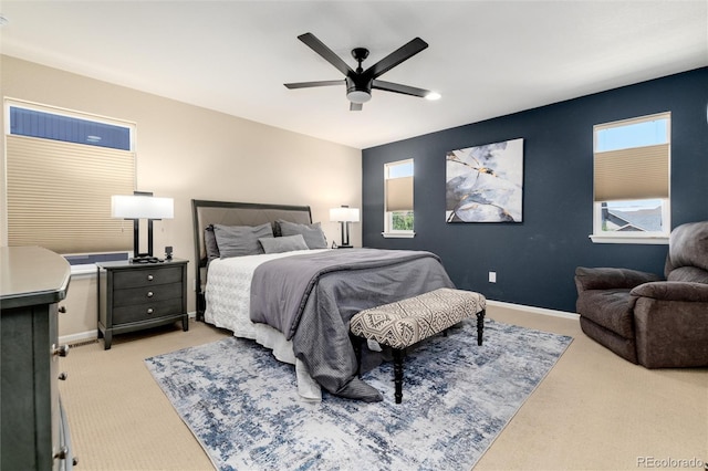 8186 E 53rd Dr, Denver, CO 80238 - bedroom with light colored carpet, multiple windows, and ceiling fan