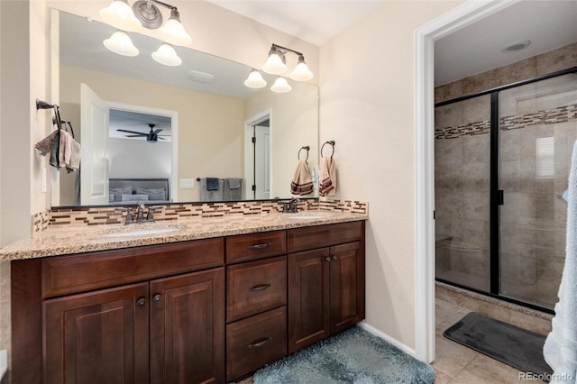 8186 E 53rd Dr, Denver, CO 80238 - ensuite bathroom featuring double vanity, a stall shower, tasteful backsplash, and ceiling fan