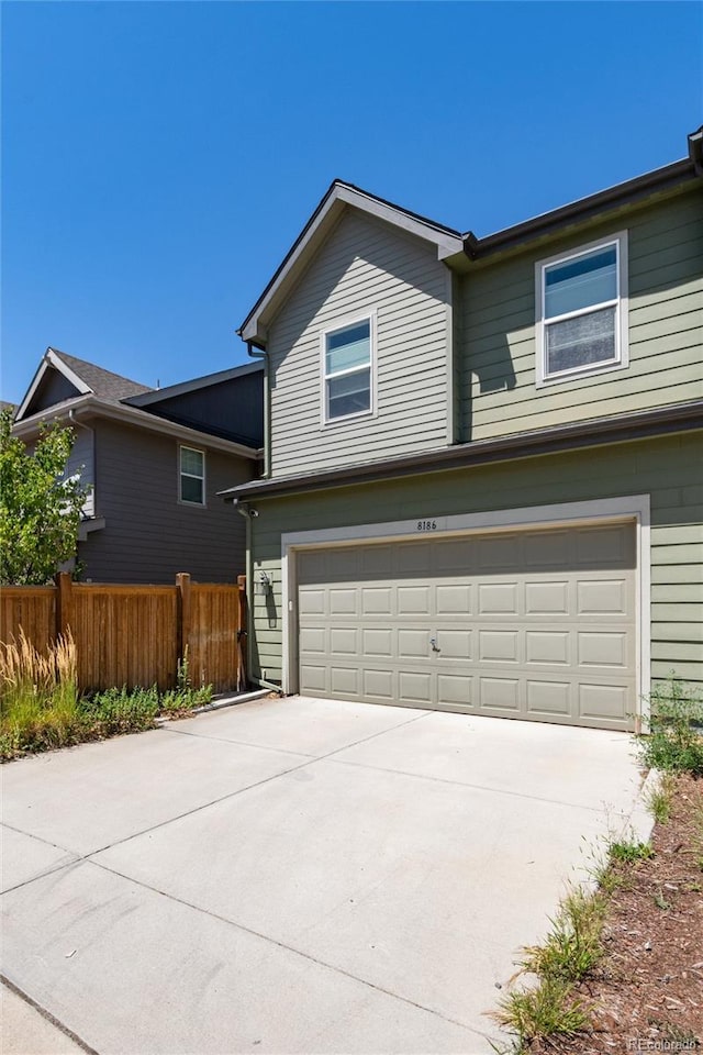 8186 E 53rd Dr, Denver, CO 80238 - view of front of house with a garage and driveway