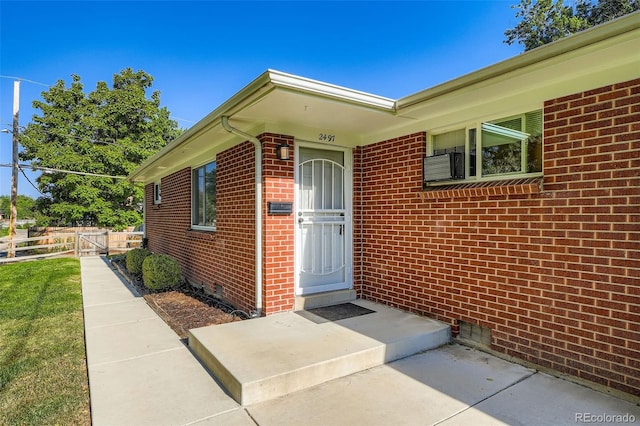 2497 S Race St, Denver, CO 80210 - property entrance with crawl space and brick siding