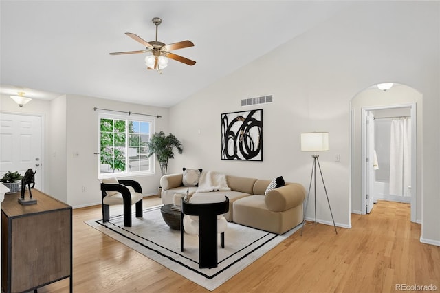 5193 Rustic Ave, Firestone, CO 80504 - living room with a ceiling fan, arched walkways, light wood finished floors, and vaulted ceiling