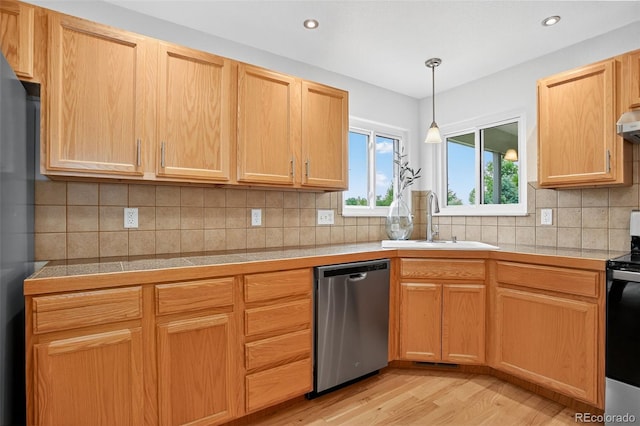 5193 Rustic Ave, Firestone, CO 80504 - kitchen with appliances with stainless steel finishes, light wood-style flooring, recessed lighting, tasteful backsplash, and under cabinet range hood