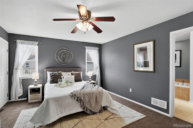 5193 Rustic Ave, Firestone, CO 80504 - bedroom with carpet, ensuite bathroom, and ceiling fan