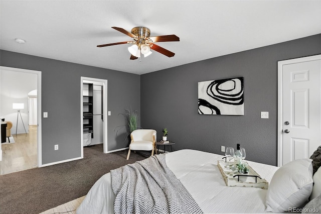 5193 Rustic Ave, Firestone, CO 80504 - bedroom featuring a spacious closet, carpet flooring, ceiling fan, and a closet
