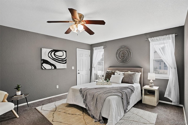 5193 Rustic Ave, Firestone, CO 80504 - carpeted bedroom with a textured wall and a ceiling fan