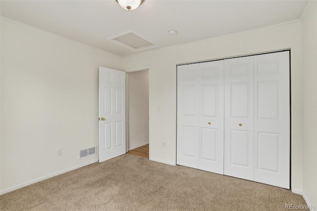 5193 Rustic Ave, Firestone, CO 80504 - unfurnished bedroom featuring attic access, carpet floors, ornamental molding, and a closet