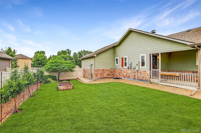 5193 Rustic Ave, Firestone, CO 80504 - fenced backyard with a garden