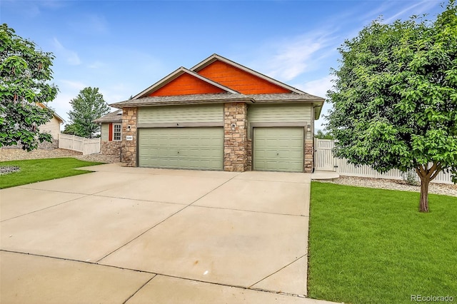 5193 Rustic Ave, Firestone, CO 80504 - view of front of home with stone siding, driveway, an attached garage, and roof with shingles