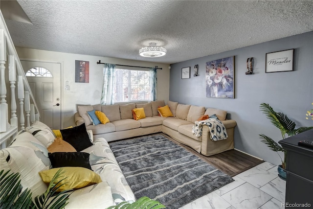 living room with a textured ceiling