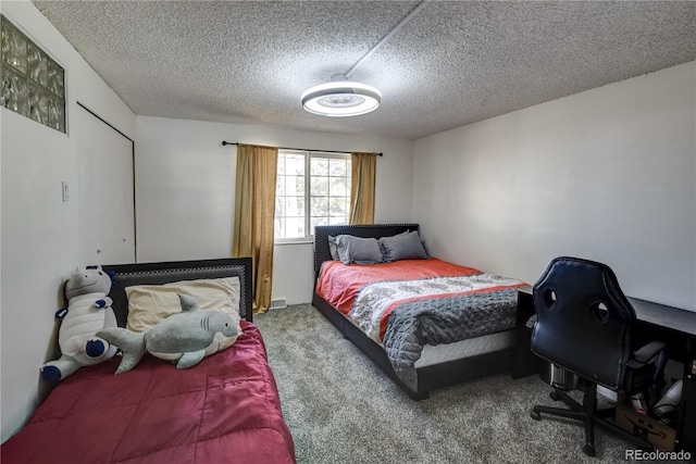 carpeted bedroom featuring a textured ceiling