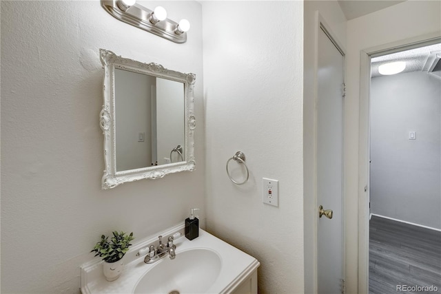 bathroom featuring hardwood / wood-style floors and vanity