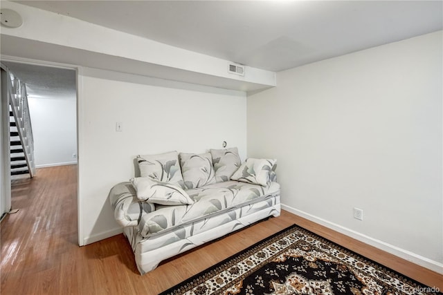 sitting room featuring hardwood / wood-style floors