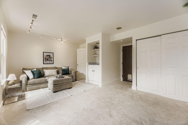 7953 S Garrison Way, Littleton, CO 80128 - living room with light colored carpet and track lighting