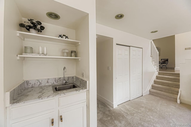 7953 S Garrison Way, Littleton, CO 80128 - indoor wet bar featuring light colored carpet and stairway