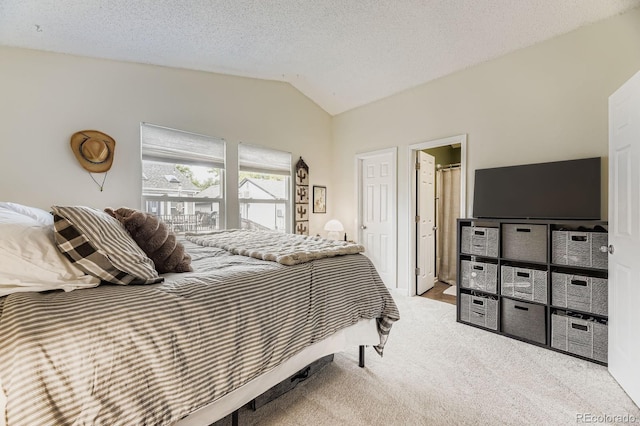7953 S Garrison Way, Littleton, CO 80128 - bedroom featuring vaulted ceiling, carpet flooring, and a textured ceiling