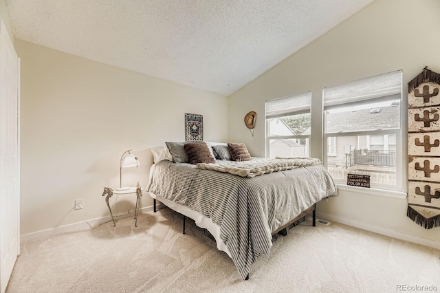 7953 S Garrison Way, Littleton, CO 80128 - carpeted bedroom featuring lofted ceiling and a textured ceiling