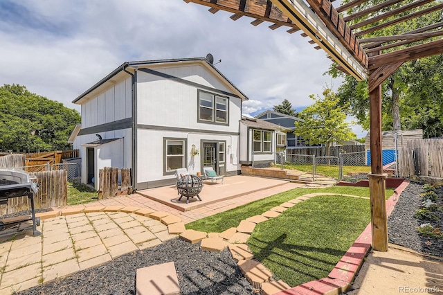 7953 S Garrison Way, Littleton, CO 80128 - back of property featuring a gate, a patio, a fenced backyard, and a pergola